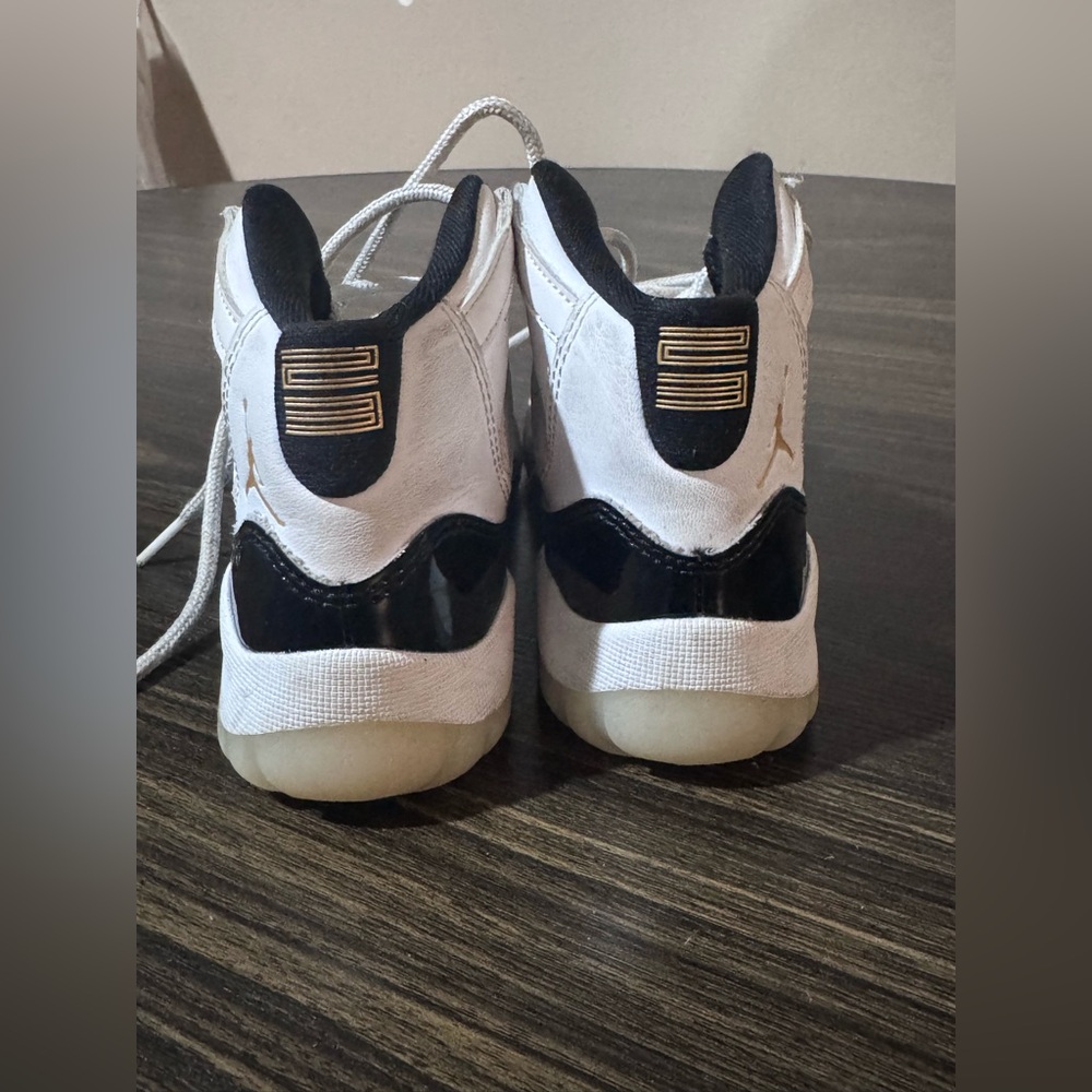 Kids White and Black Air Jordan 11s sneakers size 13C